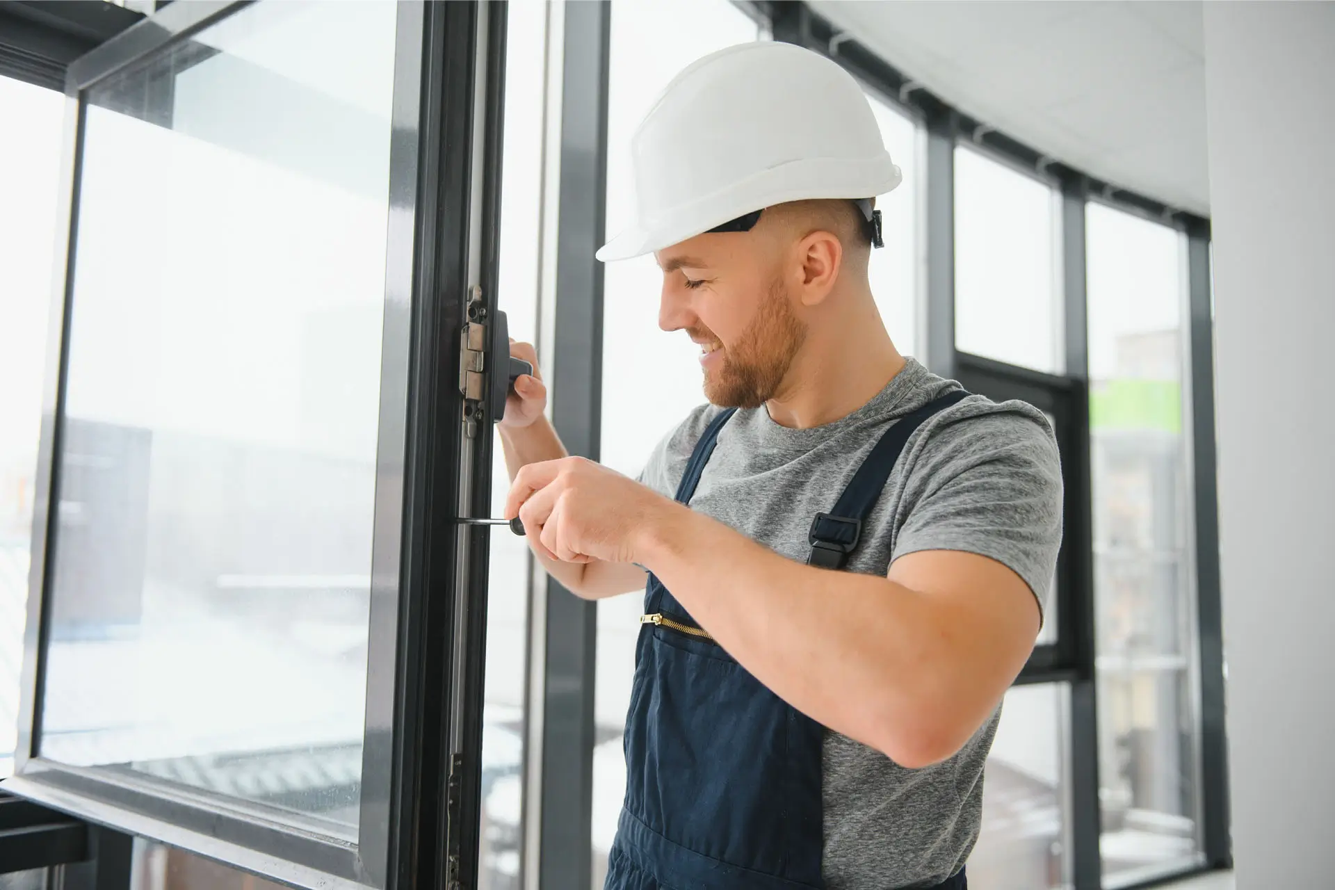 Professional master at repair and installation of windows, at work.