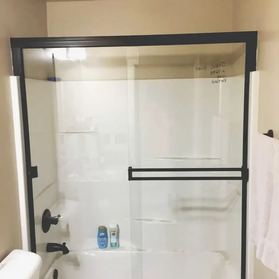 Bathroom shower sliding glass doors.